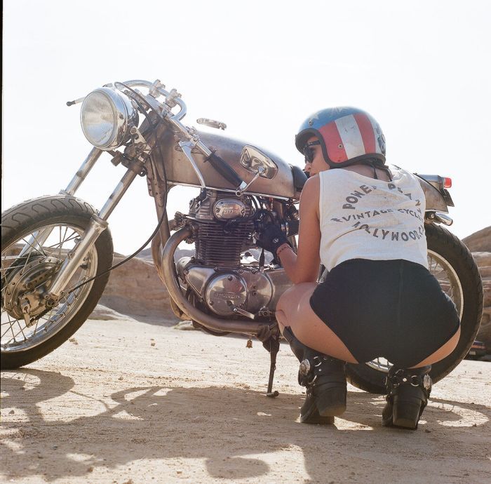 A playful frame from Girls on a motorcycle — online in Xiangtan